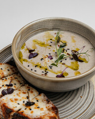 
cream soup and potatoes on a white background