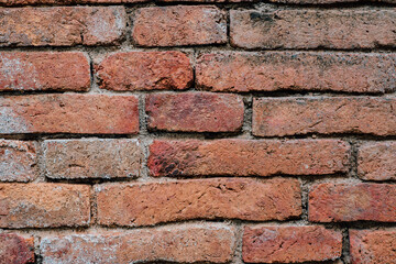 Old brick wall with devastating bricks for background.