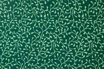 Green background with a pattern of tree branches