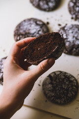 chocolate chip cookie cut in hands
