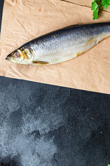 herring fish whole salted seafood ready to eat on the table meal outdoor top view copy space food background rustic image diet pescetarian