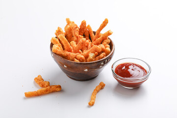Delicious Homemade kurkure snack with tomato ketchup on white background