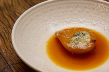Dessert Pear Brulee stuffed with Gorgonzola cheese