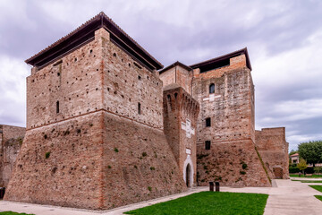 Fototapeta na wymiar The Castel Sismondo in the historic center of Rimini, Italy, under a dramatic sky