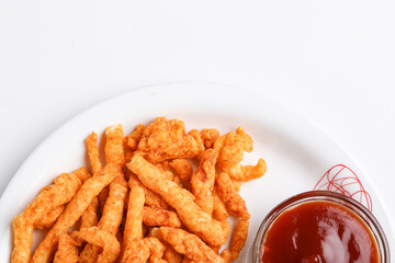 Delicious Homemade kurkure snack with tomato ketchup on white background