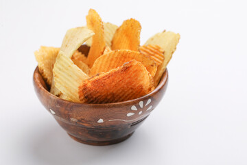 Potato chips with tomato ketchup isolated on white background