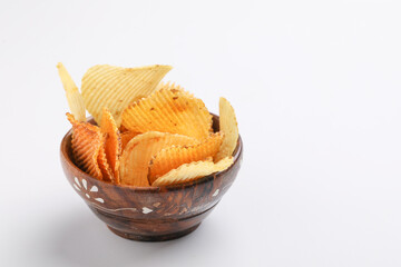 Potato chips with tomato ketchup isolated on white background