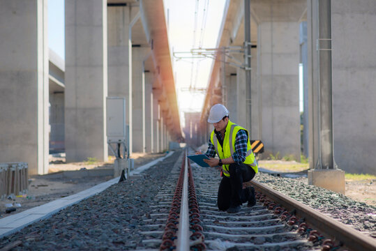 Person Walking On Railway. Engineer Sitting On Railway Inspection. Construction Worker On Railways. Engineer Work On Railway. Rail, Engineer, Infrastructure