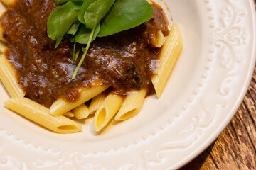 Penne pasta with oxtail ragout sauce.