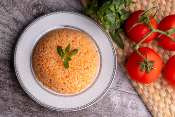 Traditional delicious Turkish food; rice pilaf with tomatoes (Turkish name; Domatesli pirinc pilavi)