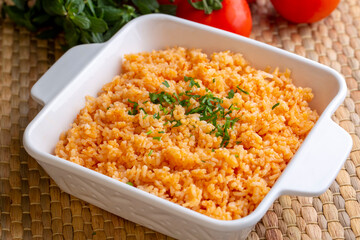 Traditional delicious Turkish food; rice pilaf with tomatoes (Turkish name; Domatesli pirinc pilavi)