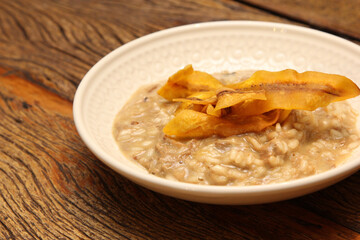 Pork risotto with fried banana-da-terra fruit chips.