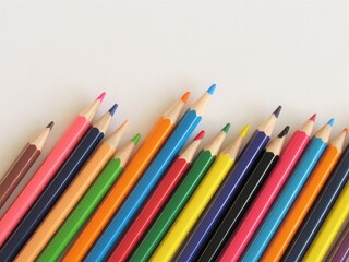 Fototapeta premium Bright colored pencils on white paper.