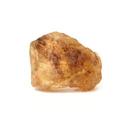 lump of brown cane sugar isolated on white background