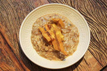 Pork risotto with fried banana-da-terra fruit chips.