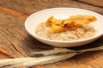 Pork risotto with fried banana-da-terra fruit chips.