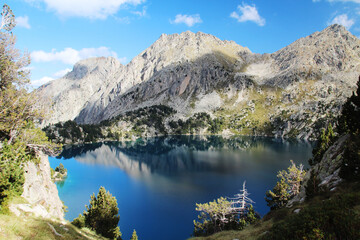 Fototapeta na wymiar Black lake in Lakes de San Mauricio National Park, Catalonia, Spain