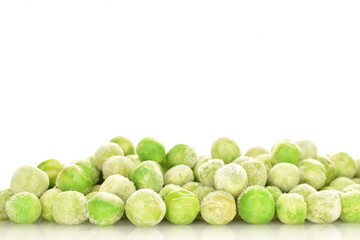 Frozen green peas, close-up, isolated on white.
