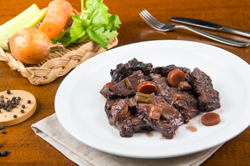 pork cheek cooked with red wine at low temperature typical dish of Lazio and Toscana region in Italy