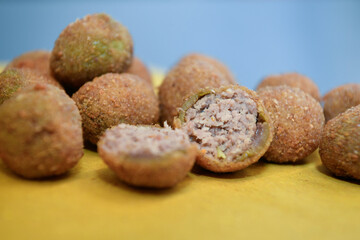 artisanal ascolana olives called Olive all'ascolana or olive ascolane are a typical dish from the Marche region, from the city of Ascoli Piceno in Italy.