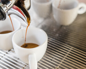 Barita making espresso from a coffee machine