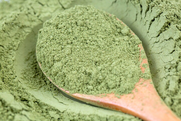 Heap of green henna powder isolated 