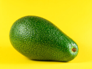 fresh avoado on yellow background