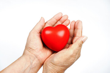 heart on hand for philanthropy concept  The old woman's hand holding a red heart in hands for valentines day or donate help give love warmth take care , World Health Day
