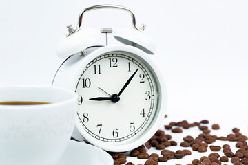 Fototapeta na wymiar Morning cup of coffee and alarm clock.White background. 