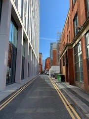 Modern buildings in Manchester City centre with a clear blue sky background. 