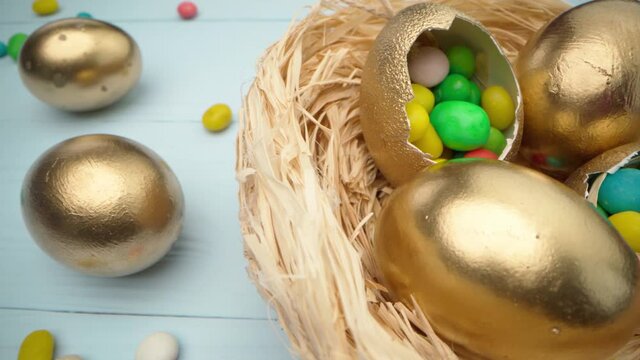 Easter egg with colorful candies in a basket close up