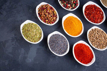 Various spices on black background