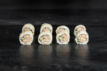 Japanese food sushi rolls uramaki    black background close-up for menu 