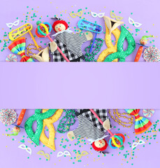 Purim celebration concept (jewish carnival holiday) over wooden purple background. Top view, flat lay