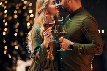 Sincere emotions and feelings. Young lovely couple have romantic dinner indoors together