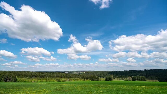White clouds in the sky and beautiful field scenery, time-lapse