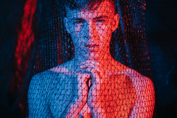 Human trafficking. Forced labour. Freedom protection. Despair shirtless man hostage praying to God...