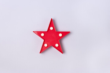 Red Star with Lamp on Blue Background Top View Horizontal