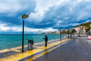Cesme coastal view at windy day in Cesme Town of Izmir Province. Cesme is populer tourist destination in Turkey. - obrazy, fototapety, plakaty