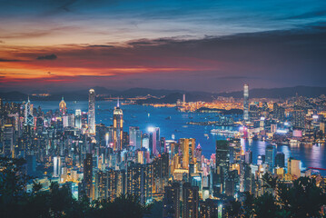 Fototapeta na wymiar Hong Kong city on dramatic sky at sunset view from mountain.