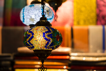 Traditional handmade multicolor Turkish, Moroccan, Arabian lamps hanging with nice blurred...