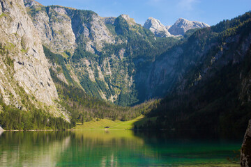 Fototapeta na wymiar The Obersee which is behind the Konigssee as a quite place for hiking and relaxing and to enjoy nature in Germany