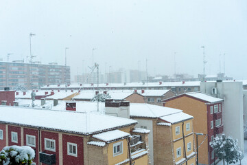 roofs of the houses completely covered with snow by the storm Filomena
