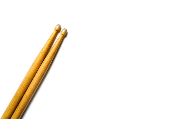 Drum stick on white table background, top view, music concept