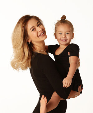 Girl And Mom In Black Body Having Fun Cuddle Close Up Studio Portrait Isolated On White