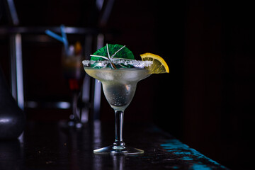 Alcoholic cocktail in a night bar close-up.