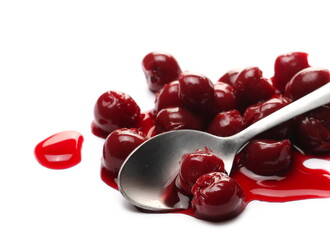 Sour cherry compot, fruit kompot with metal spoon isolated on white background