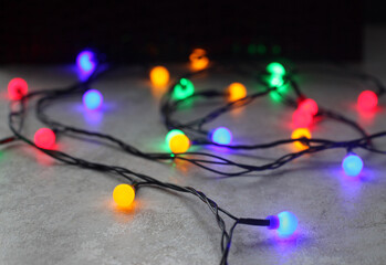 Christmas multicolored lights on a dark background