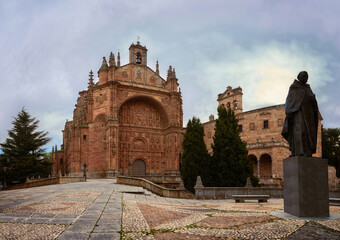 Facade of the Convent of San Esteban and honorary statue to Francisco e Vitoria, from the city of Salamanca, Castilla y León, Spain, photograph taken in winter 2020 (December-January)