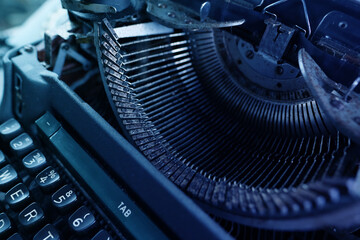 old typewriter on table, words fake news are printed on paper in large size, retro style, concept...